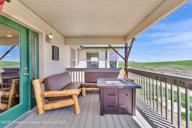 1210 County Road 103, Craig, CO 81625 - wooden deck with an outdoor fire pit