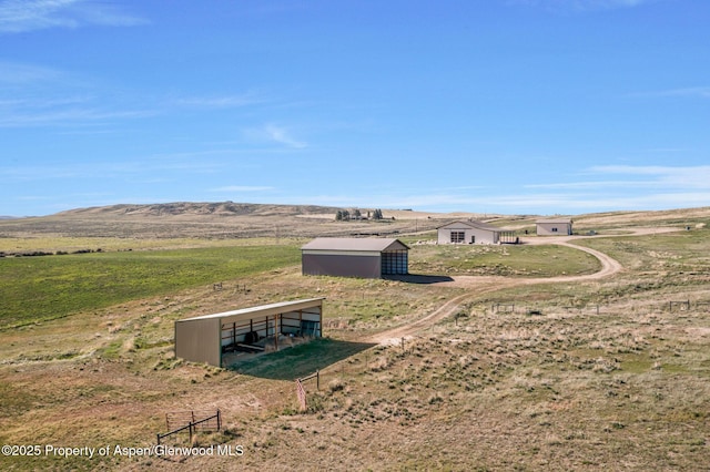 1210 County Road 103, Craig, CO 81625 - view of yard featuring an outbuilding, a pole building, a view of rural / pastoral area, and a storage unit