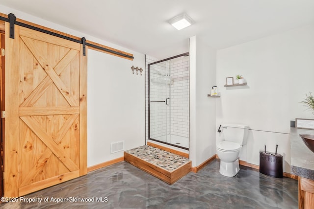 1210 County Road 103, Craig, CO 81625 - bathroom with concrete flooring, a shower stall, toilet, and baseboards