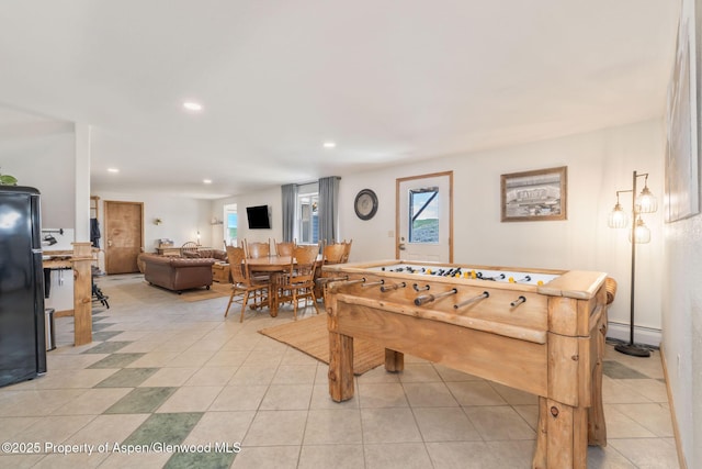 1210 County Road 103, Craig, CO 81625 - rec room featuring recessed lighting, plenty of natural light, light tile patterned flooring, and baseboard heating