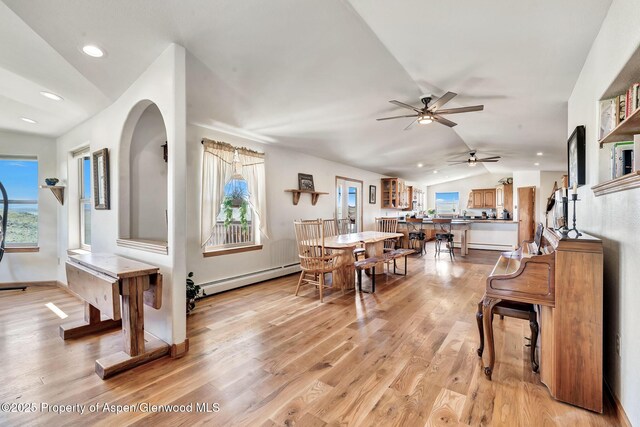 1210 County Road 103, Craig, CO 81625 - dining area featuring baseboard heating, vaulted ceiling, a ceiling fan, light wood finished floors, and recessed lighting