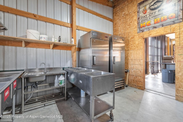 1210 County Road 103, Craig, CO 81625 - misc room featuring concrete floors, a high ceiling, and a sink