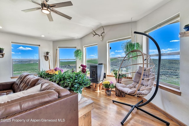 1210 County Road 103, Craig, CO 81625 - living area featuring plenty of natural light, wood finished floors, a ceiling fan, recessed lighting, and lofted ceiling
