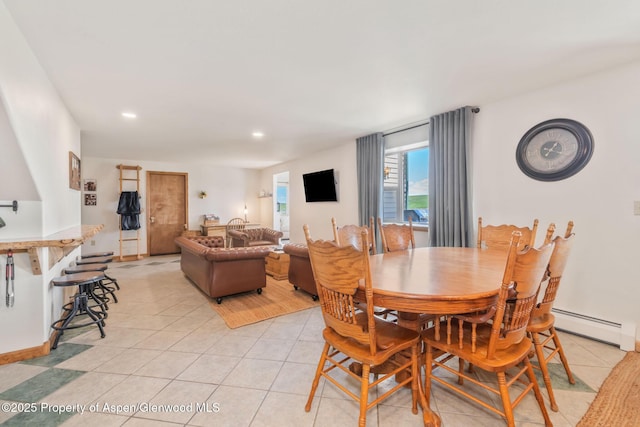 1210 County Road 103, Craig, CO 81625 - dining room with baseboard heating, light tile patterned flooring, and recessed lighting