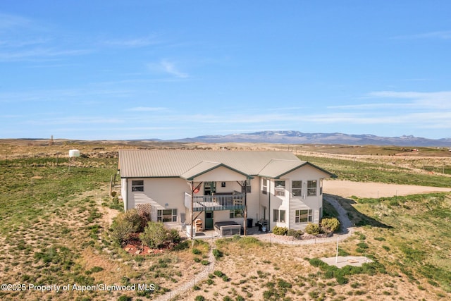 1210 County Road 103, Craig, CO 81625 - rear view of house featuring a mountain view and metal roof