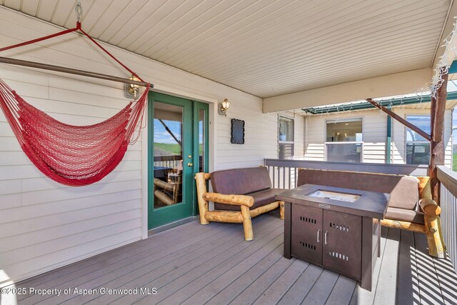 1210 County Road 103, Craig, CO 81625 - wooden deck featuring a fire pit