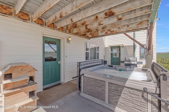 1210 County Road 103, Craig, CO 81625 - view of patio with a hot tub and grilling area