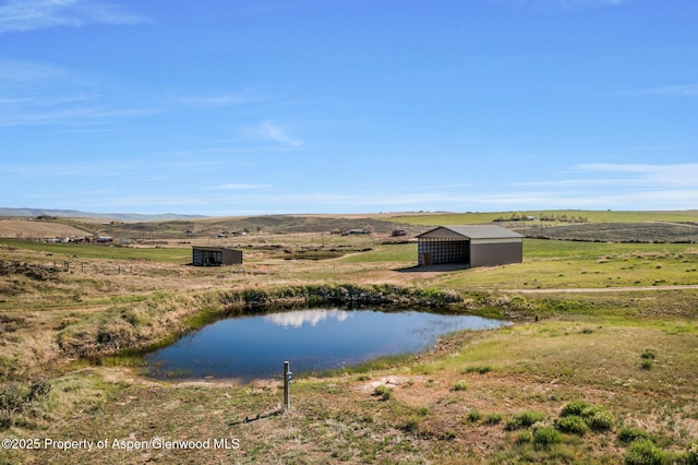 1210 County Road 103, Craig, CO 81625 - water view featuring an outbuilding and rural landscape
