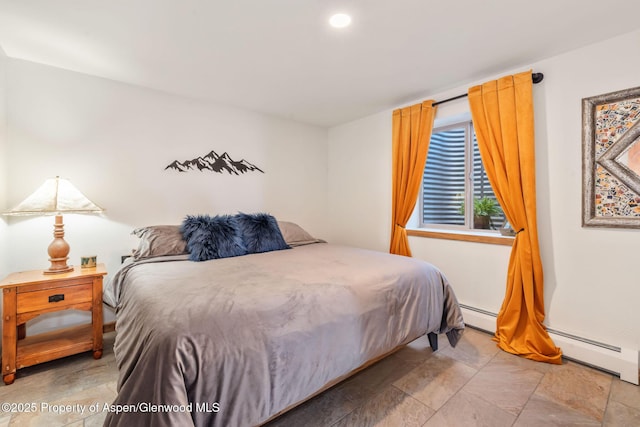 1210 County Road 103, Craig, CO 81625 - bedroom with stone finish floors and a baseboard radiator