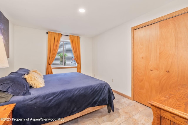 1210 County Road 103, Craig, CO 81625 - bedroom with recessed lighting, baseboards, and a closet