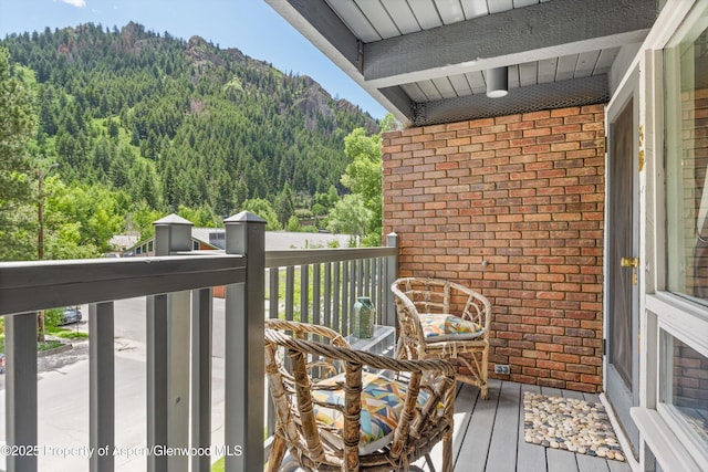 124 W Hyman Ave Unit 3B, Aspen, CO 81611 - balcony featuring a wooded view and a mountain view