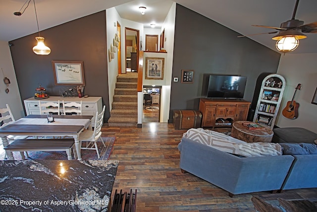 212 Safflower Ct, New Castle, CO 81647 - living room with wood finished floors, lofted ceiling, stairs, and a ceiling fan