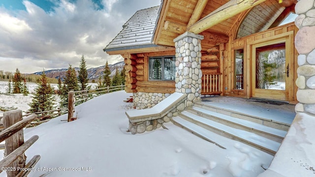 2418 Usfs Rd Unit 526, Creede, CO 81130 - snow covered patio featuring a mountain view and covered porch