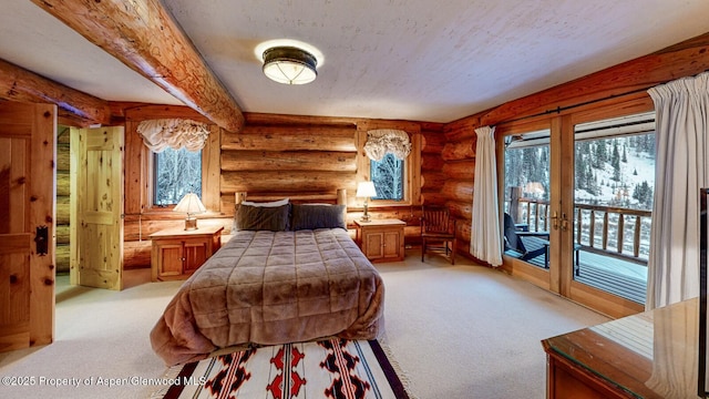 2418 Usfs Rd Unit 526, Creede, CO 81130 - bedroom with multiple windows, access to exterior, light carpet, rustic walls, and beam ceiling