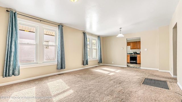 unfurnished living room with carpet