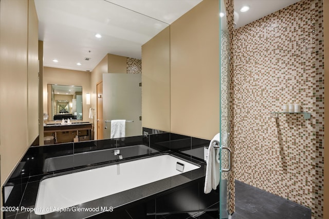 bathroom featuring vanity and an enclosed shower