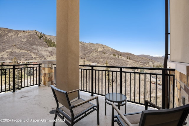 balcony featuring a mountain view