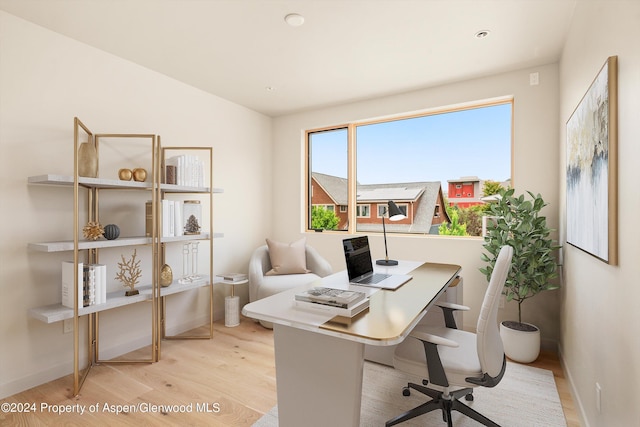 office featuring light hardwood / wood-style flooring and vaulted ceiling