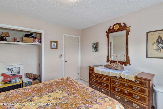 bedroom featuring a textured ceiling