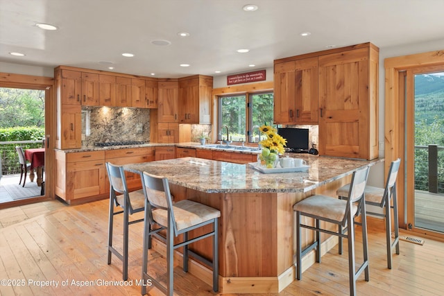 554 Sinclair Rd, Snowmass Village, CO 81615 - kitchen featuring healthy amount of natural light, stainless steel gas stovetop, light wood-type flooring, and recessed lighting