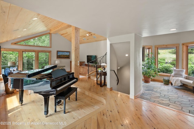 554 Sinclair Rd, Snowmass Village, CO 81615 - living area featuring hardwood / wood-style floors, recessed lighting, stairway, and lofted ceiling