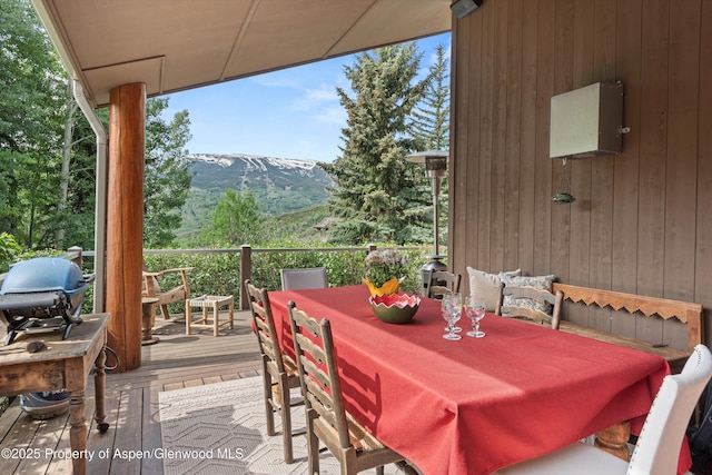 554 Sinclair Rd, Snowmass Village, CO 81615 - wooden terrace with a mountain view, outdoor dining area, and grilling area