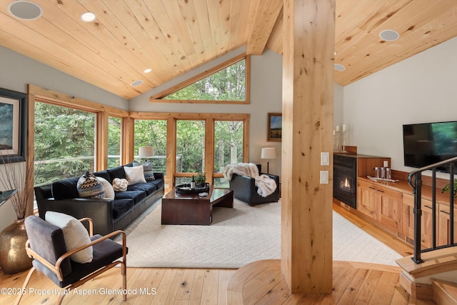 554 Sinclair Rd, Snowmass Village, CO 81615 - living area with hardwood / wood-style floors, recessed lighting, a glass covered fireplace, wooden ceiling, and high vaulted ceiling