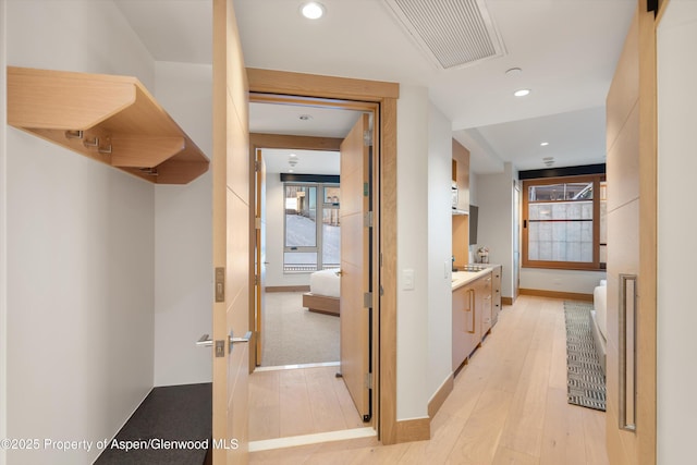 hall featuring light hardwood / wood-style floors