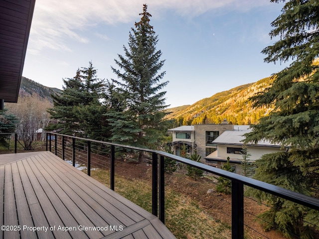 wooden terrace with a mountain view
