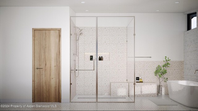 bathroom with shower with separate bathtub