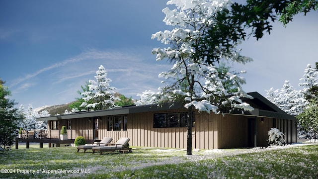 view of front of property with a wooden deck