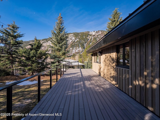 wooden deck featuring a mountain view