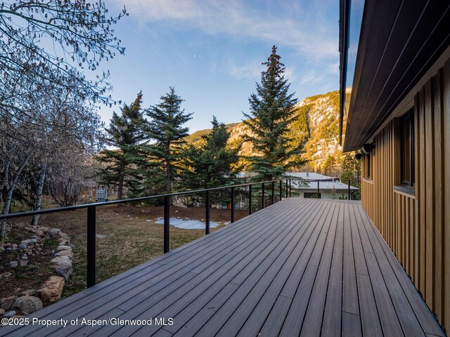 wooden terrace with a mountain view