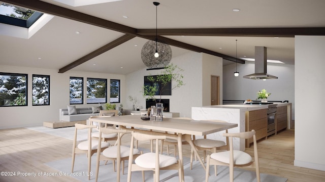 dining space featuring light wood-type flooring and lofted ceiling with skylight