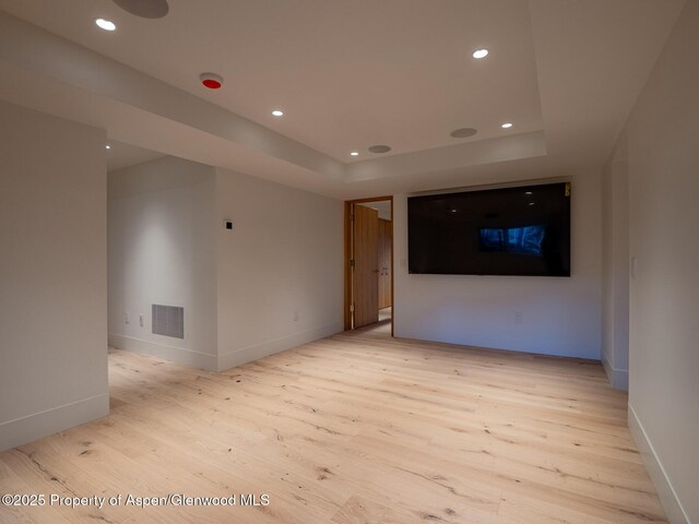 spare room featuring recessed lighting, baseboards, visible vents, and light wood finished floors
