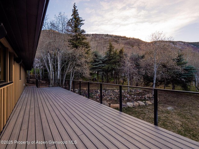 wooden terrace featuring a mountain view