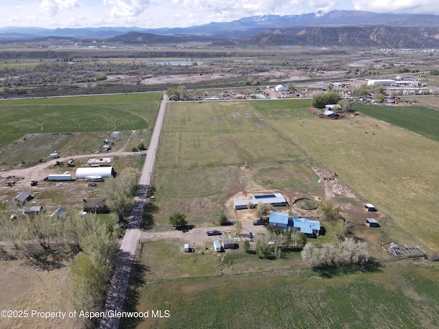 449 County Road 223, Rifle, CO 81650 - aerial overview of property's location with rural landscape and a mountainous background