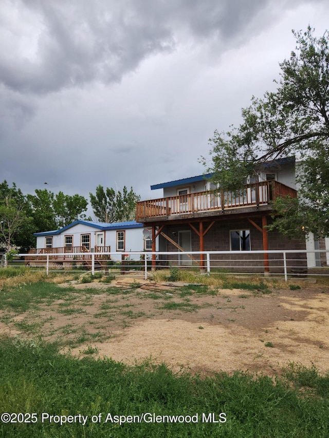 449 County Road 223, Rifle, CO 81650 - rear view of property featuring a wooden deck