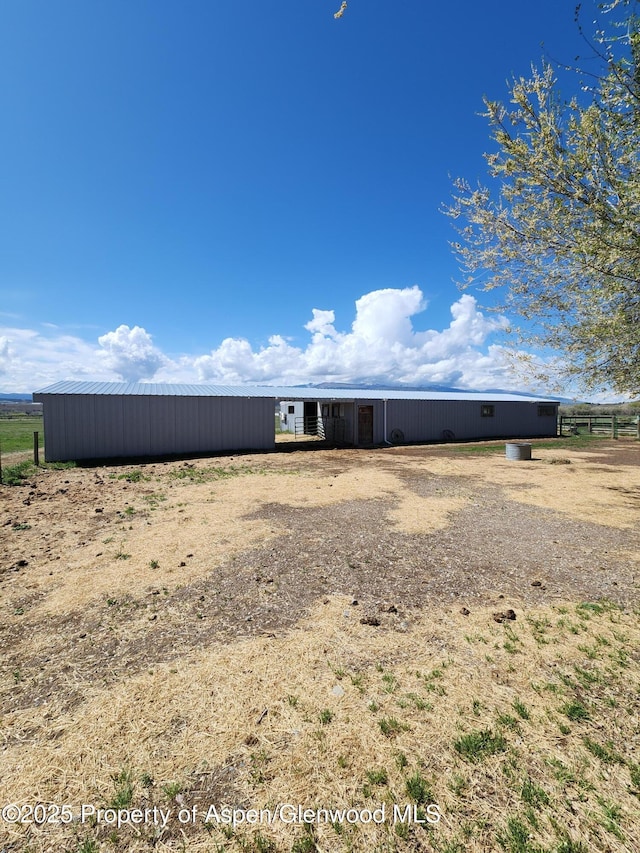 449 County Road 223, Rifle, CO 81650 - rear view of house featuring a pole building and an outbuilding