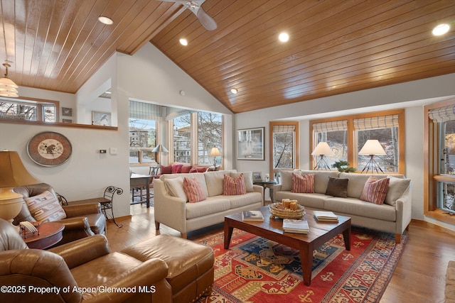 living area with wood ceiling, high vaulted ceiling, wood finished floors, and recessed lighting