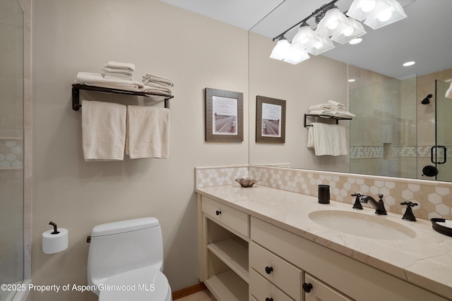 full bathroom featuring tasteful backsplash, a shower stall, toilet, and vanity