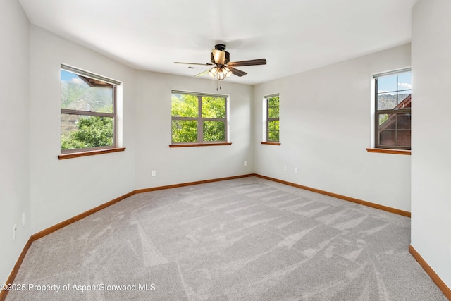 383 Faas Ranch Rd, New Castle, CO 81647 - carpeted empty room with plenty of natural light and a ceiling fan