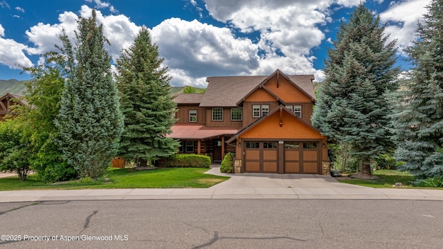 383 Faas Ranch Rd, New Castle, CO 81647 - craftsman-style home featuring concrete driveway, a garage, a front lawn, and stone siding