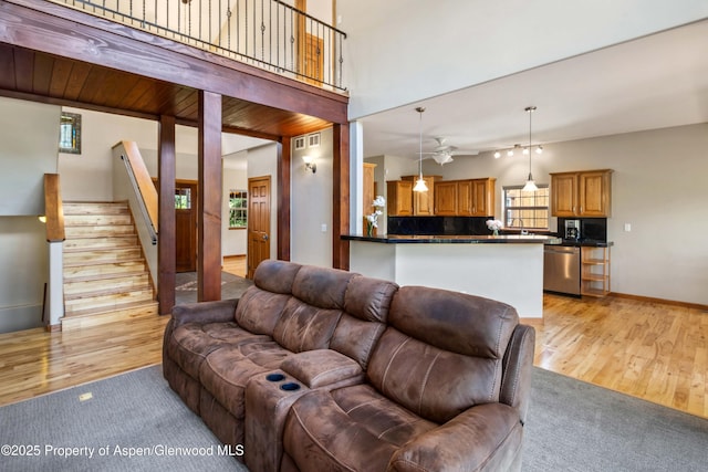 383 Faas Ranch Rd, New Castle, CO 81647 - living area with light wood-style floors, stairs, and ceiling fan