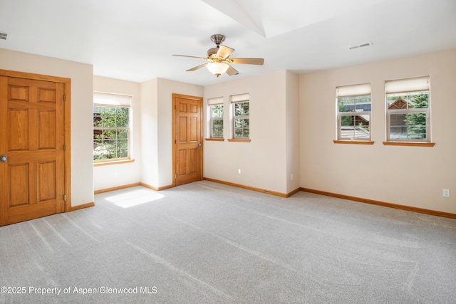 383 Faas Ranch Rd, New Castle, CO 81647 - empty room with plenty of natural light, a ceiling fan, and light carpet