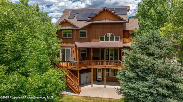 383 Faas Ranch Rd, New Castle, CO 81647 - back of house with roof with shingles, a patio area, solar panels, and a balcony