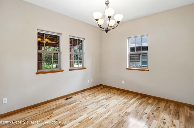 383 Faas Ranch Rd, New Castle, CO 81647 - empty room with a chandelier and wood finished floors