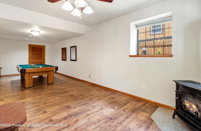 383 Faas Ranch Rd, New Castle, CO 81647 - recreation room featuring a wood stove, ceiling fan, billiards table, and wood finished floors
