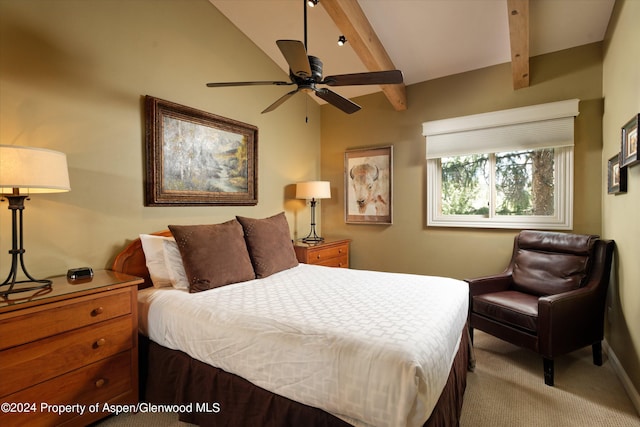 carpeted bedroom featuring lofted ceiling with beams and ceiling fan