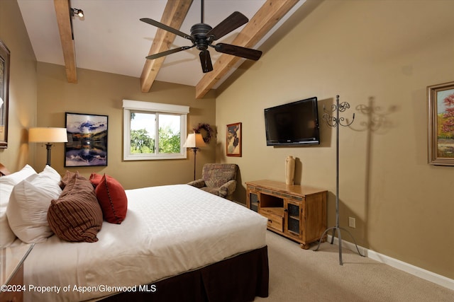 bedroom with vaulted ceiling with beams, ceiling fan, and light colored carpet